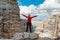 Active hiker hiking, enjoying the view, looking at Dolomites mountains landscape