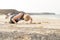 Active Lady Doing Push-Ups by the Seaside