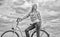 Active leisure and healthy activity. Girl ride cruiser model bicycle. Woman rides bicycle sky background. Healthiest