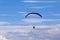 Active lifestyle, extreme hobbies. Skydiver flight against the blue sky.