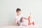 Active little boy playing the rocket toys, Child showing rocket toy with happy face, Children or Toddler learning and