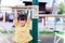 Active little child girl playing on playground. Children hands holding with workout machine  hung on the gymnastic bar.