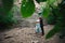 Active loving senior couple walking in beautiful summer forest