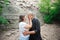 Active loving senior couple walking in beautiful summer forest