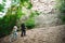 Active loving senior couple walking in beautiful summer forest - active retirement concept