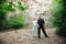 Active loving senior couple walking in beautiful summer forest - active retirement concept.