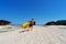 Active male surfer running with surfboard on sand beach enjoying healthy lifestyle extreme sport