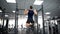 Active man doing pull ups in gym, body workout program, strong muscles training