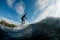 active man running on the wave with hydrofoil foil board