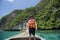 Active man on thai traditional longtail Boat is ready to snorkel and dive, Phi phi Islands, Thailand