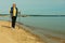 Active mature lifestyle. senior nordic walking on a sandy beach