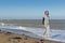 Active mature woman walking in the sea