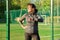 Active middle aged woman in sportswear looking at her wrist watch, exercise time