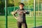 Active middle aged woman in sportswear looking at her wrist watch, exercise time