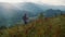 Active millennial travel mountains nature. Young woman trekking on landscape.