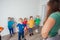 Active and motivated kids doing sport exercises at kindergarten