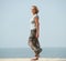 Active older woman walking at the beach