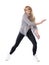 Active passionate blonde woman dancing jazz dance in unbuttoned striped shirt