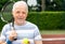 An active pensioner, portrait of senior man playing tennis in outside, retired sports, sport concept