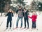 Active rest. Family skiing in the winter forest