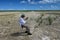 Active senior explores and photographs solution holes in Everglades.