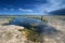 Active senior explores and photographs solution holes in Everglades.