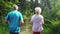 Active senior man and woman running for better fitness