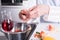 Active senior preparing paprika in kitchen