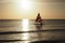 Active senior sailing at sunset off Captiva Island.