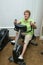 Active Senior Woman Exercise Bike Machine