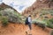 Active Senior Woman hiking in a beautiful red rock canyon