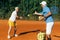 Active Senior Woman Practicing Tennis