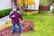 Active Senior Woman Raking Leaves