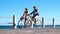 Active seniors going on a bike ride by the sea