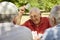 Active seniors, group of old friends playing cards at park