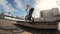 Active skilled guy BMX rider practices jumps and spins on bike in urban space