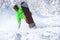 Active snowboarder rides in powder