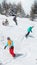 Active snowboarders riding on slope. Snowboarding closeup. Sheregesh ski resort