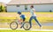 active son and father duo cycling on bicycle. Shared cycling experience. father teaching his son to ride a bicycle