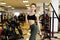 Active sportive athletic woman with dumbbells pumping up muscles biceps concept fitness sport training