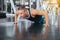 Active strong man doing push up and exercises on floor at gym