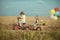 Active toddler kid playing and cycling outdoors. Children farmer in the farm with countryside background. Cute toddler