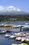 active volcanoes in Chile, seen from Pucon.with boat marina with luxurious architecture.may 2016