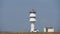 An active white Marine lighthouse on the steppe coast.