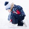 Active winter holiday - cute little boy skating on an ice rink