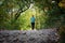 Active woman approaching running on a trail in the nature