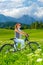 Active woman on bicycle in mountains