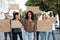 Active woman leading a group of demonstrators on the street