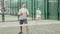 Active woman and man with enthusiasm playing padel on the tennis court