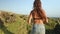 Active woman running to banawa beach cliff edge